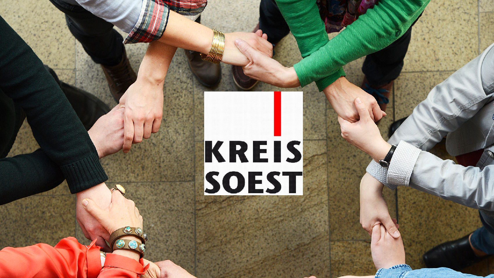 Sich verbindende Hände, in der Mitte das Logo des Kreis Soest